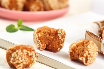 Traditional Guangxi Chinese Sesame Seed Pastries Crispy Golden Specialty Snacks with Mint Garnish