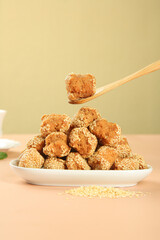 Traditional Guangxi Sesame Balls - Crispy Chinese Pastries with Sesame Seeds on White Plate
