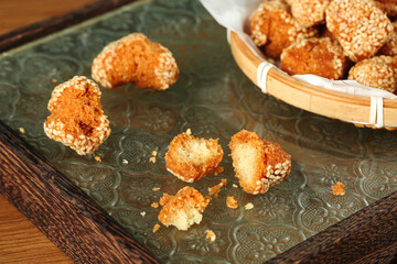 Golden Crispy Chinese Sesame Balls Guangxi Specialty Traditional Pastry Dessert in Bamboo Basket