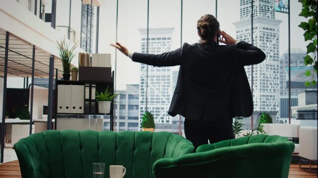 Male CEO manages a conversation with advisory board via phone call, making strategic business decisions while reviewing financial updates. Strong communication within an enterprise. Camera A.