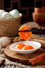 Fresh Organic Egg Yolk Separation in Rustic Farmhouse Kitchen with White Shell Eggs and Wicker Basket