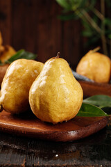Fresh Ripe Golden Pears on Wooden Board with Leaves - Organic Fruit Still Life Photography