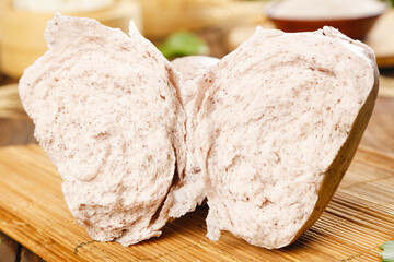 Fototapeta premium Buckwheat bread buns split on wooden board - healthy whole grain bakery stock photo