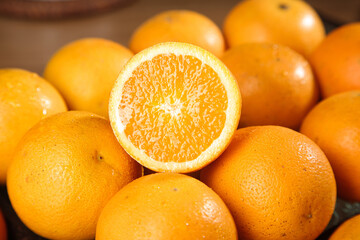 Fresh Orange Citrus Fruit Cut in Half Showing Juicy Interior - Healthy Summer Food