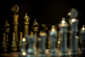 Chess pieces and game board with dark background environment