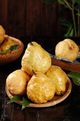Fresh Pears in Wooden Baskets - Organic Fruit Harvest Display on Rustic Dark Background