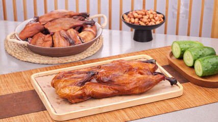 Chinese Roasted Duck with Cucumbers and Peanuts Traditional Hunan Cuisine on Wooden Board