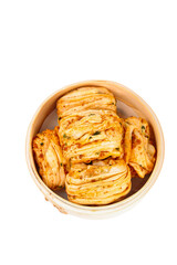 Korean Kimchi Cabbage Rolls in Bamboo Steamer on White Background