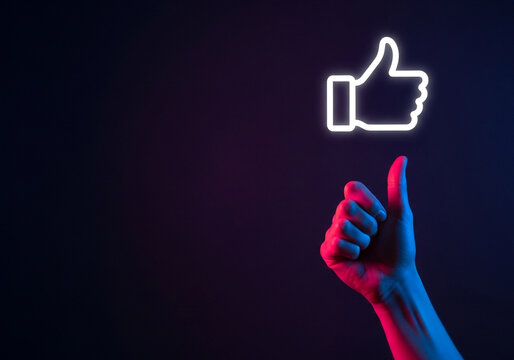 A hand showing a thumbs-up gesture with a glowing like icon, perfect for social media approval, positive feedback, and customer satisfaction