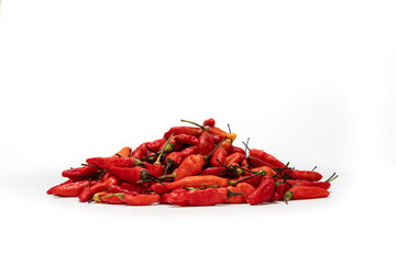 a pile of red birds eye chili pepper with shadow isolated in white background