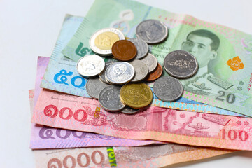 Banknotes with coins of the Thai baht money