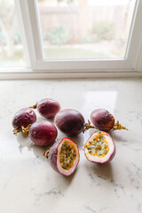 delicious and juicy exotic fruit - passion fruit on a kitchen counter, natural light