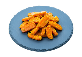 Prepared, sliced carrots, with a golden-yellow sauce, arranged attractively on a dark slate plate, against a pure black background.