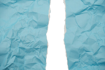 Torn blue textured paper reveals bright white abstract space and grungy background