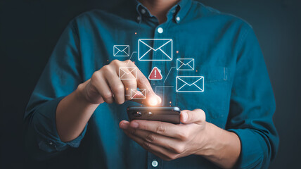 Man's hands holding smartphone interacting with email notifications and alerts