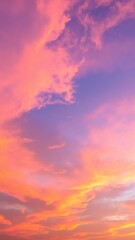 A breathtaking pink sky at dusk, adorned with fluffy white clouds, casting a warm glow over the horizon, creating a serene and dreamy atmosphere.
