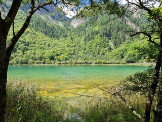 Reflection on the surface of a lake in summer in Jiuzhaigou National Park, China.