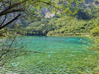 Reflection on the surface of a lake in summer in Jiuzhaigou National Park, China.
