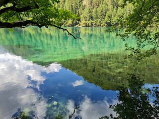 Reflection on the surface of a lake in summer in Jiuzhaigou National Park, China.