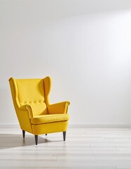 A vibrant yellow chair stands alone in a spacious, empty room with white walls and a polished wooden floor, casting a soft shadow in the sunlight.