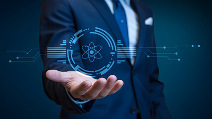 Businessman presents futuristic atomic technology interface with digital innovation on hand