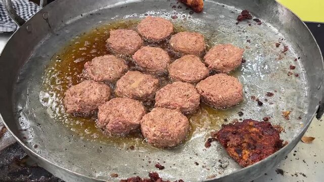 Cooking Galouti kebab with raw minced meat in India