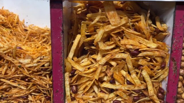 Different types of fried Gujarati snacks sold in a shop in Rajasthan 