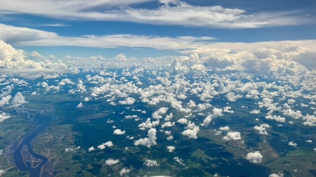 Aerial View of Tropical Jungle and Clouds Over Vast Landscape in Daytime Adventure Scene