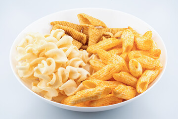 Assorted Crispy Snacks Mix in White Bowl on White Background