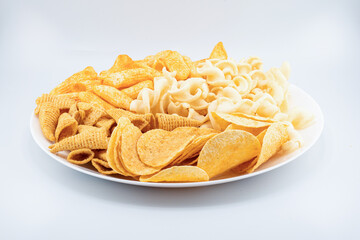 Assorted Crispy Snacks Mix in White Bowl on White Background