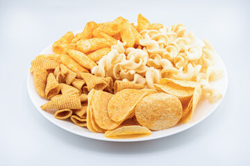Assorted Crispy Snacks Mix in White Bowl on White Background
