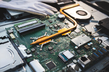 Close-up image of an all-in-one computer interior showing the motherboard, heat pipe cooling...