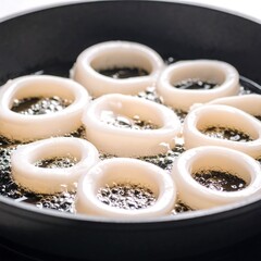 Squid rings frying in a pan