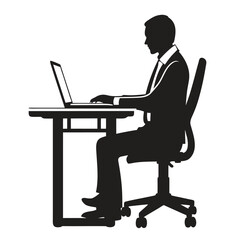 Silhouette of a businessman working on a laptop at a desk