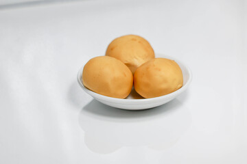Potato ring biscuit snack close-up, white background