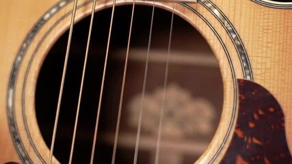 Close-up of an acoustic guitar soundhole