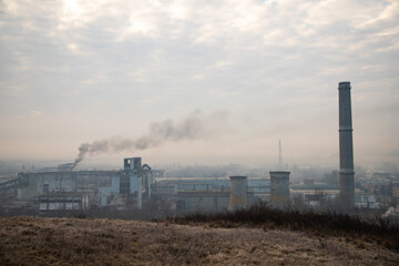 Obraz premium Factory in winter fog, dirty pollution city
