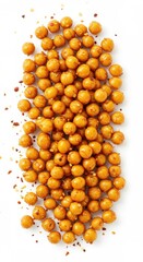 Fototapeta premium Golden-brown, spiced chickpea snacks arranged atop a white background.