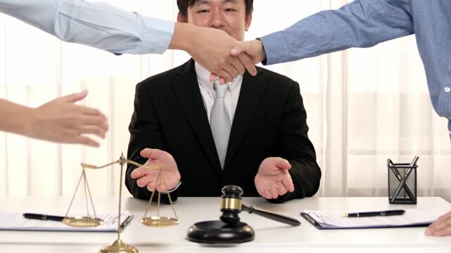 Corporate attorney applaud as business people make a successful deal or agreement with handshake, celebrating mutually beneficial acquisition. Business handshaking concept. Slow motion. Rigid.
