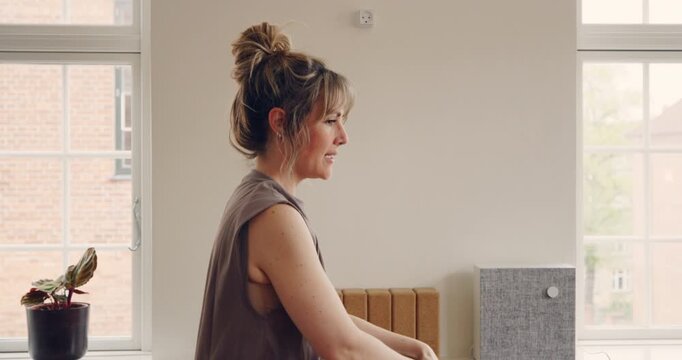 Yoga teacher leading a mixed age range group
of students through the warrior three pose
during a beginners yoga class