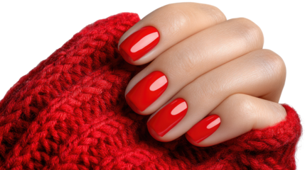 Crimson Delight: A close-up shot of manicured nails painted a vibrant red, elegantly displayed against a textured red fabric, showcasing a perfect blend of beauty and comfort.