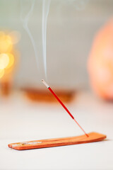 Burning scented stick burning on table