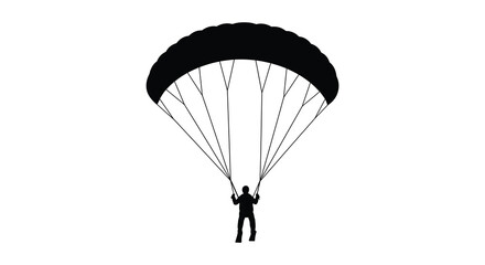A silhouetted view of a paraglider descending from the sky above