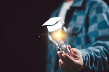 businessperson hands showing light bulb, E-learning graduate certificate program concept. Internet...