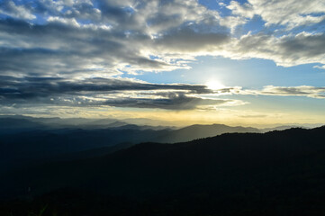 Landscape Sunset in Twilight time Over the Mountains in the Evening  at Doi Suthep-Pui National Park,Chiang mai, Northern Thailand.