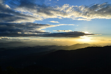 Landscape Sunset in Twilight time Over the Mountains in the Evening  at Doi Suthep-Pui National Park,Chiang mai, Northern Thailand.