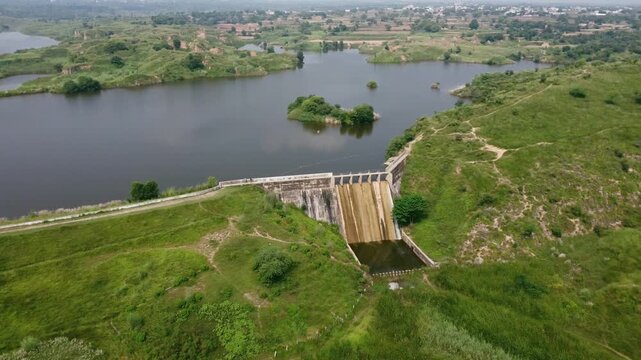 aerial panoramic view of small dam spillway and village life in dungi gujjar khan rawalpindi pakistan showing rural heritage