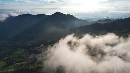 Aerial view landscape of fog flowing on mountains in the morning by drone