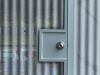 Metal security door with lock and perforated sheet design