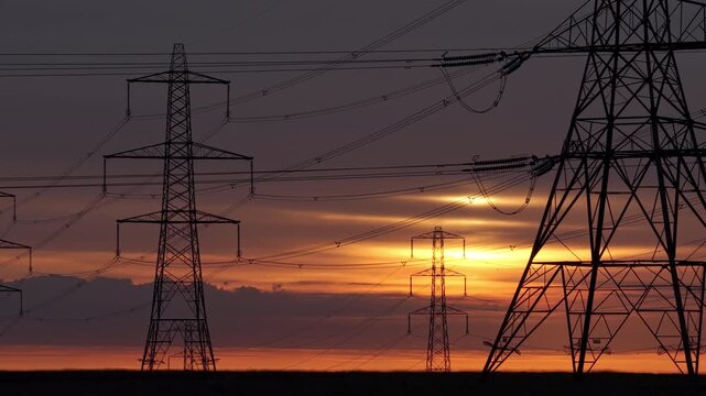 Sunrise over Electricity Pylons Across Rishworth Moor  Yorkshire